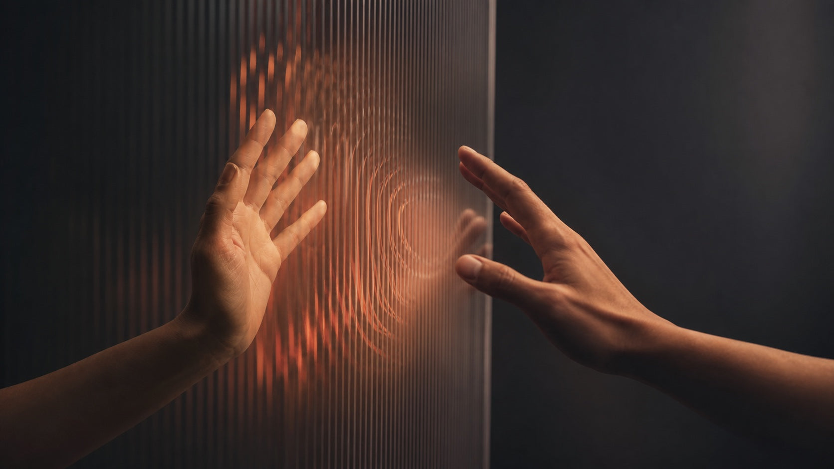 Two hands sensing one another across a softly lit acoustic surface